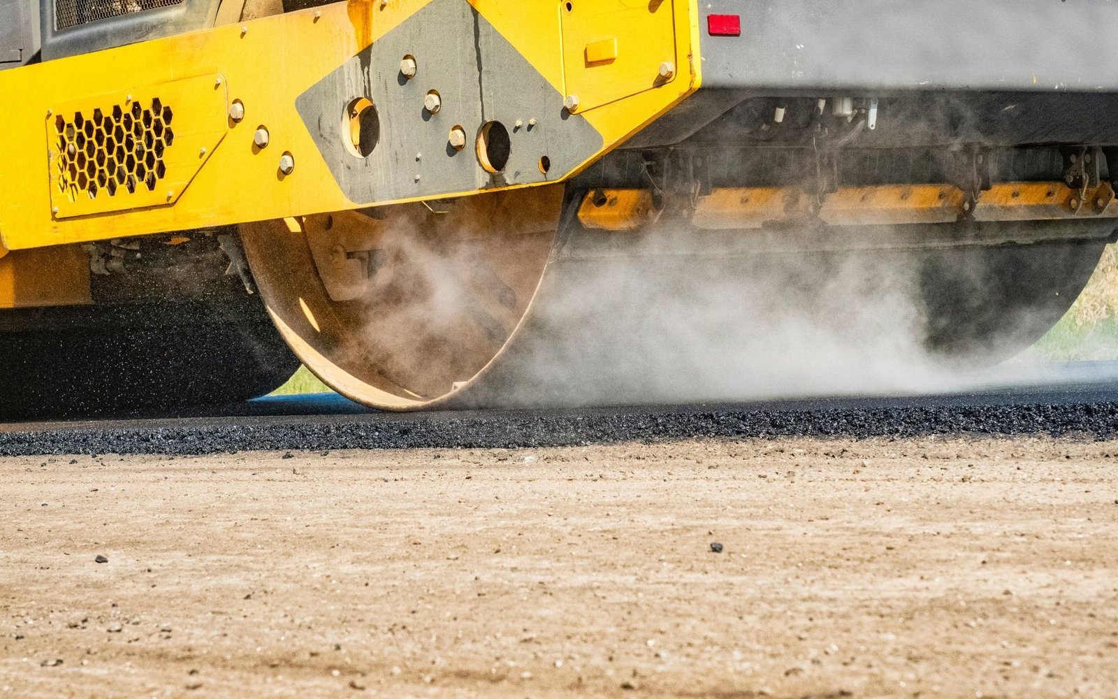 asphalt rollers are used to create the perfect surface for this asphalt parking lot in Port St. Lucie, FL