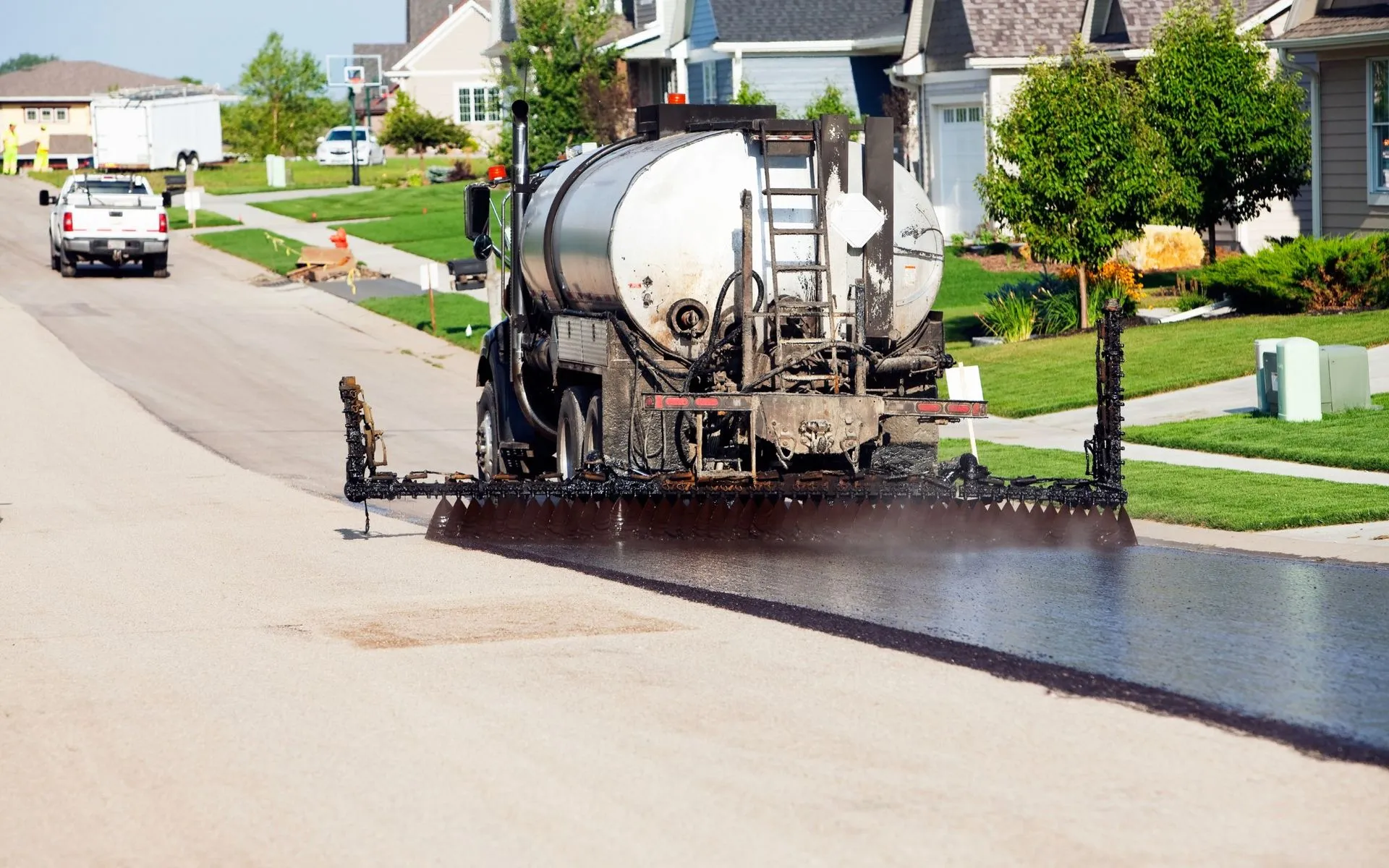 asphalt sealcoating in a community road in Port St Lucie, FL